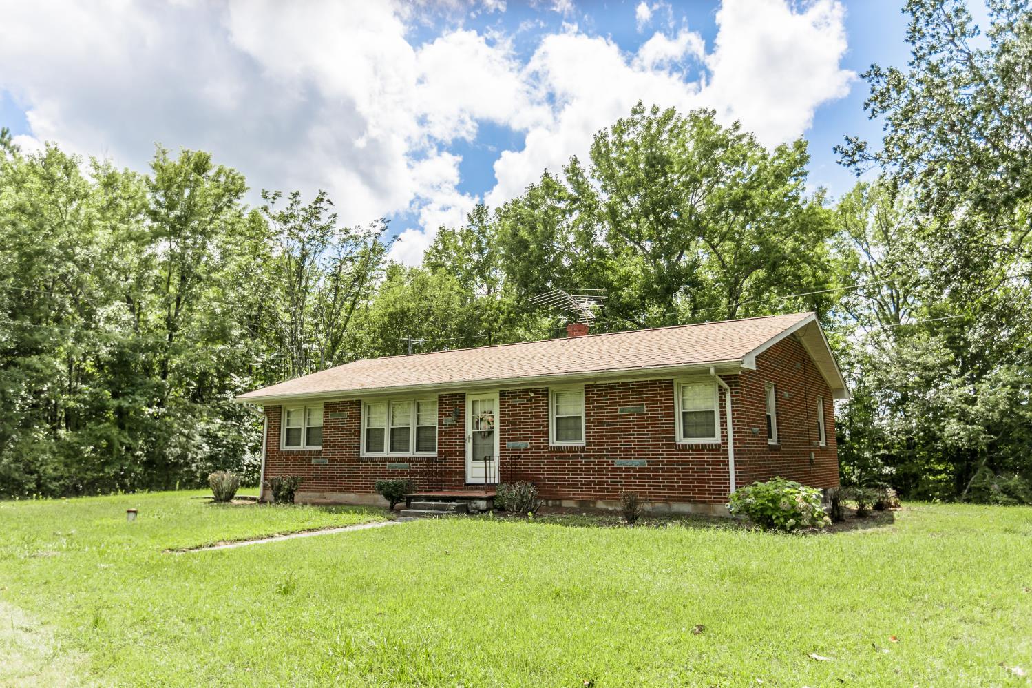 1338 Wickliffe Road Brookneal, VA 24528 - Photo 1 of 24 a front view of a house with a yard