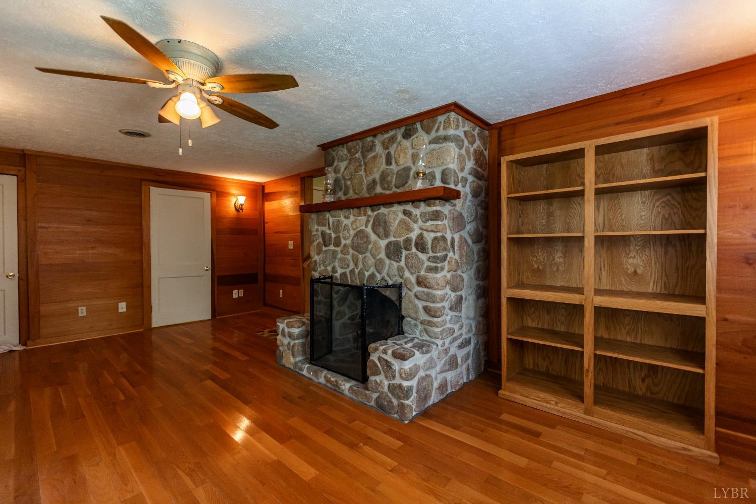 1338 Wickliffe Road Brookneal, VA 24528 - Photo 12 of 24 a living room with furniture and a fireplace
