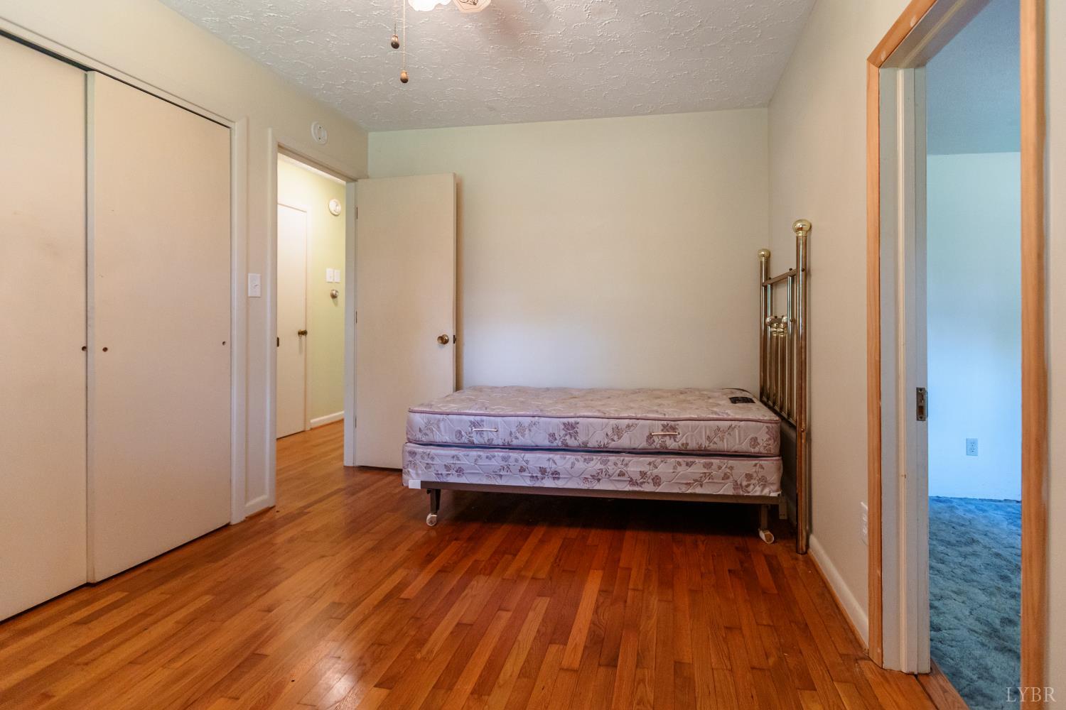 1338 Wickliffe Road Brookneal, VA 24528 - Photo 15 of 24 a view of a room with wooden floor and bench