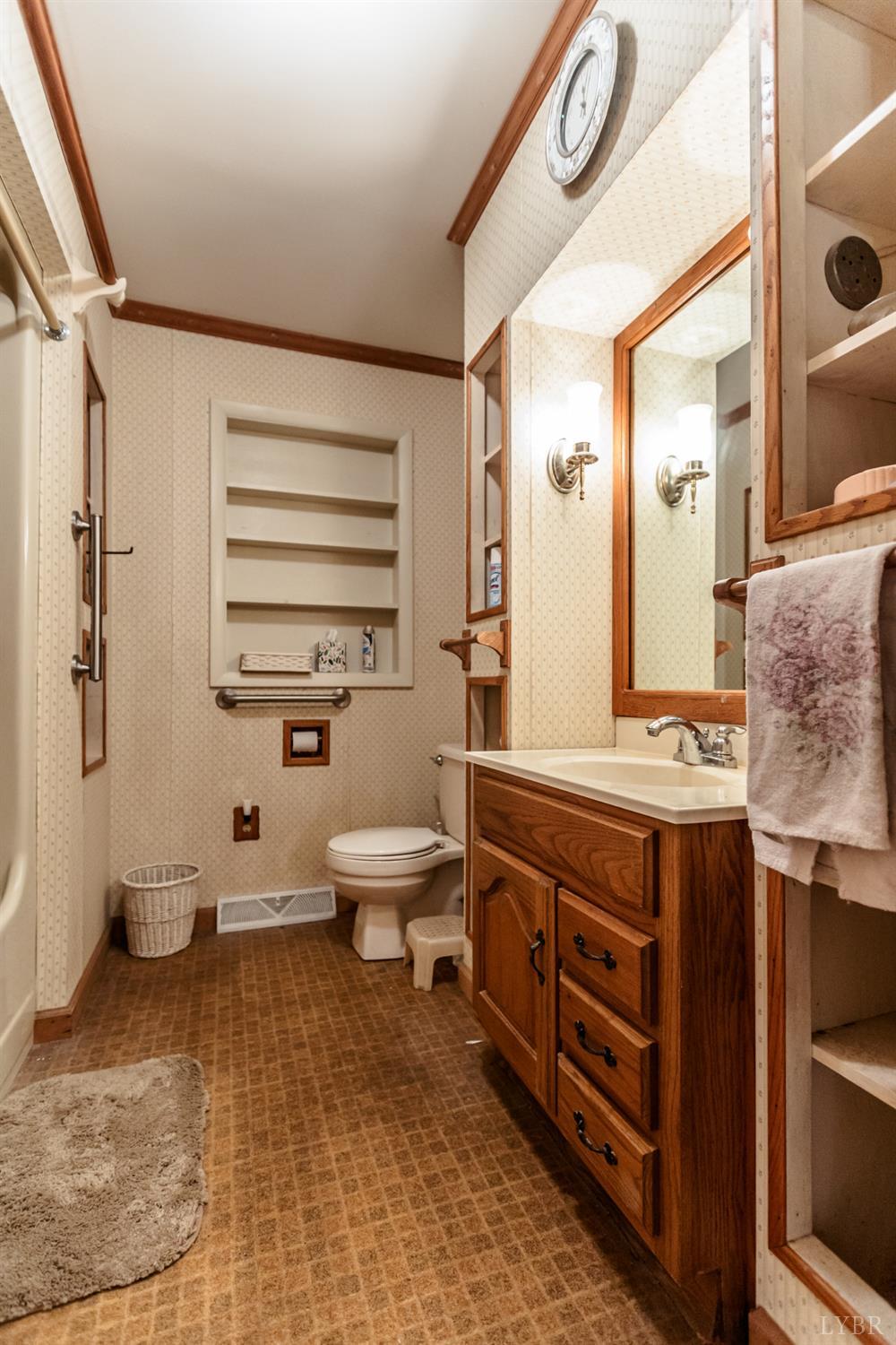 1338 Wickliffe Road Brookneal, VA 24528 - Photo 20 of 24 a spacious bathroom with a double vanity sink toilet and shower