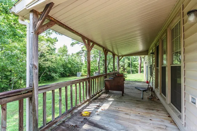 a view of porch with furniture and garden