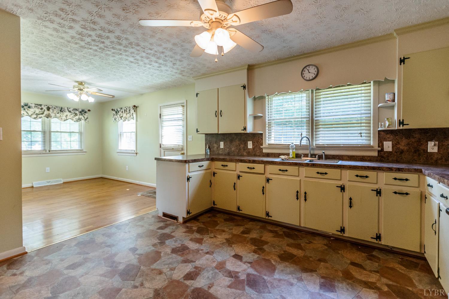 1338 Wickliffe Road Brookneal, VA 24528 - Photo 7 of 24 a kitchen with a stove a sink and a refrigerator