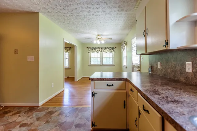 a view of a bathroom with dual sinks