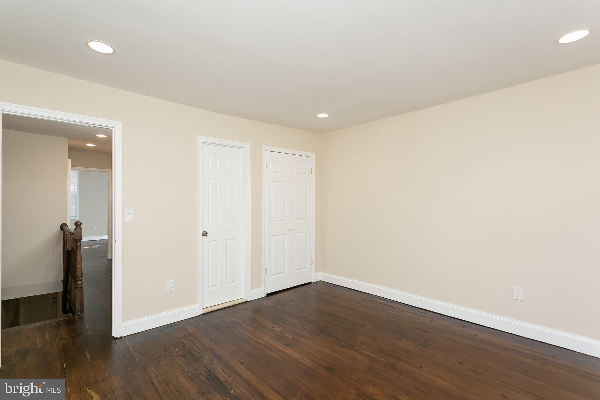 302 East 27th Street Baltimore, MD 21218 - Photo 13 of 31 Large back bedroom with lots of light