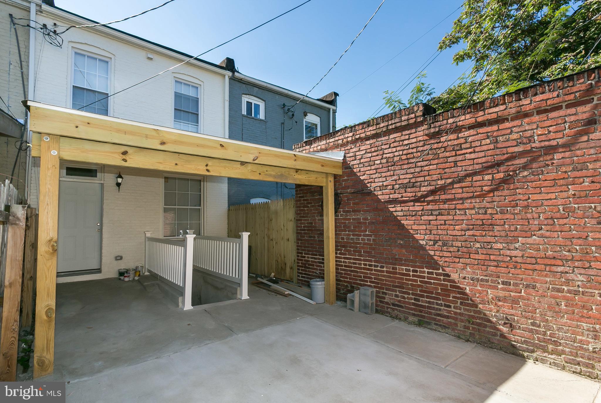 302 East 27th Street Baltimore, MD 21218 - Photo 29 of 31 fenced in back patio with door to basement
