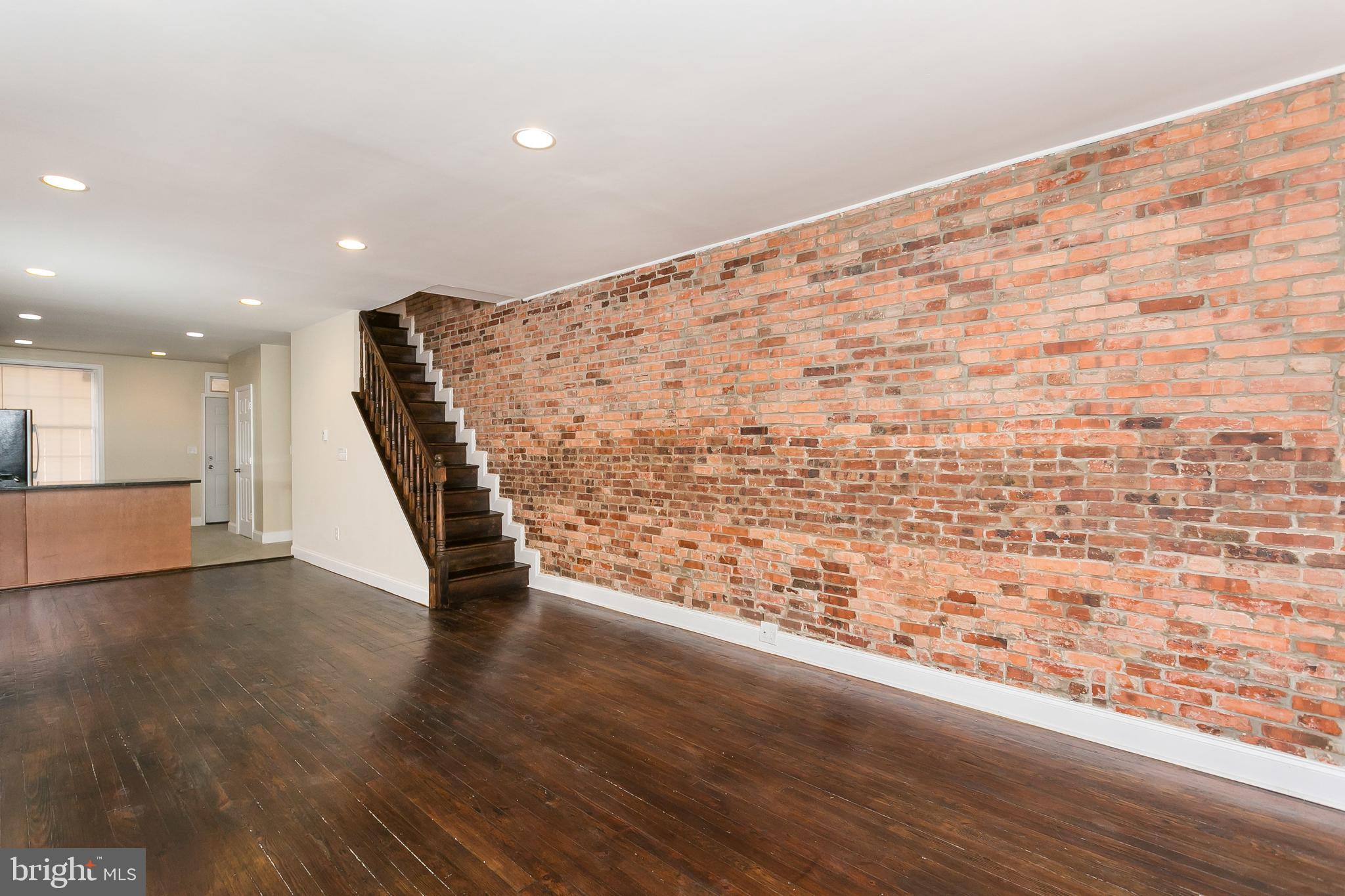 302 East 27th Street Baltimore, MD 21218 - Photo 4 of 31 Open layout with hardwood and charm