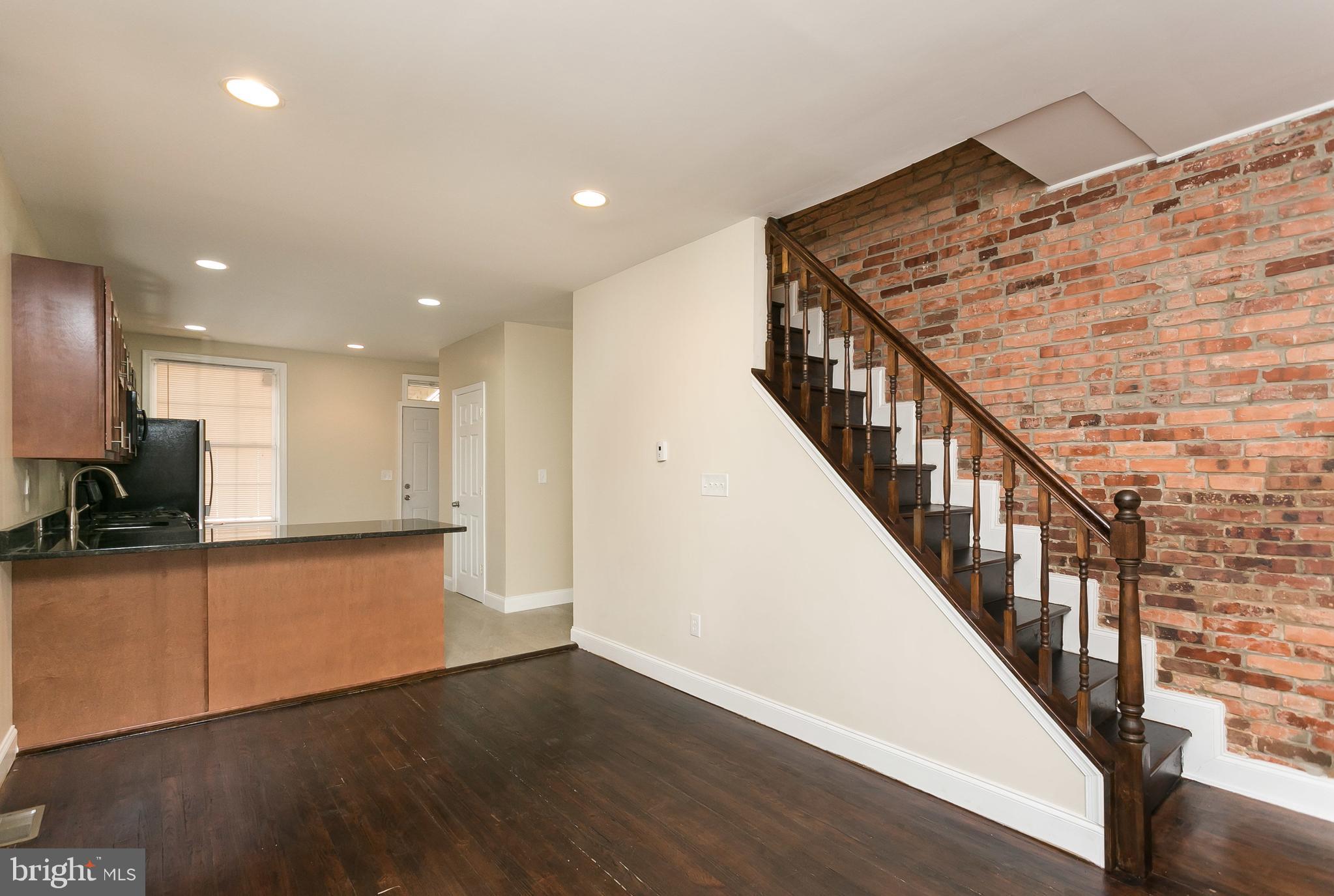 302 East 27th Street Baltimore, MD 21218 - Photo 6 of 31 Dining area open to updated kitchen