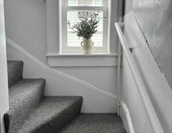 67 Wheatland Street, Unit 2 Somerville, MA 02145 - Photo 16 of 19 a living room with furniture and a large window