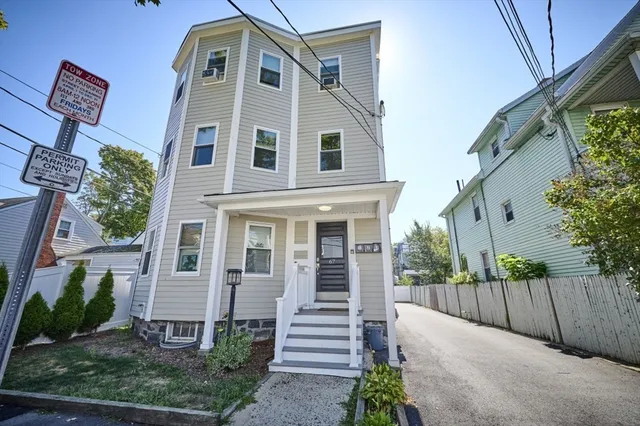 a front view of a house with a yard