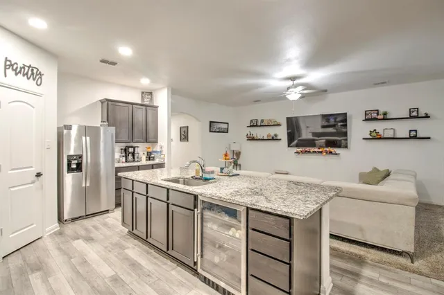 a view of a house with a yard and sitting area