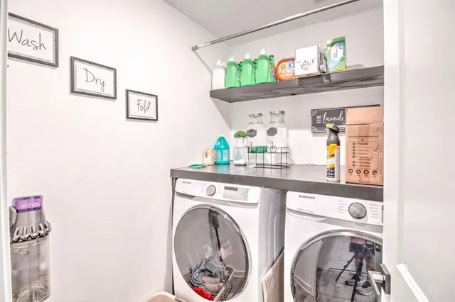 a living room with furniture a air conditioner and a table