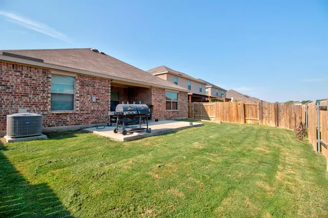 a bedroom with furniture and a floor to ceiling window