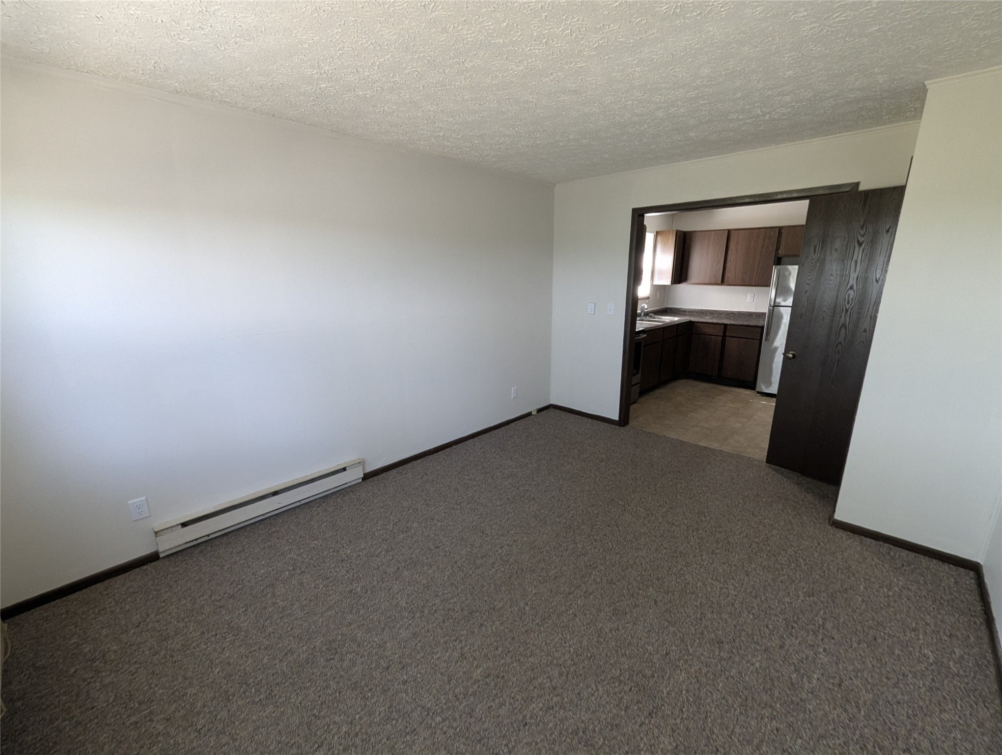 207 Stringtown Road Minier, IL 61759 - Photo 7 of 9 a view of an empty room and kitchen