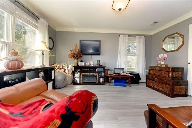 a bedroom with bed and a window