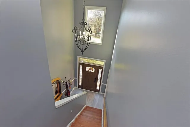 a view of a livingroom with wooden floor and a window