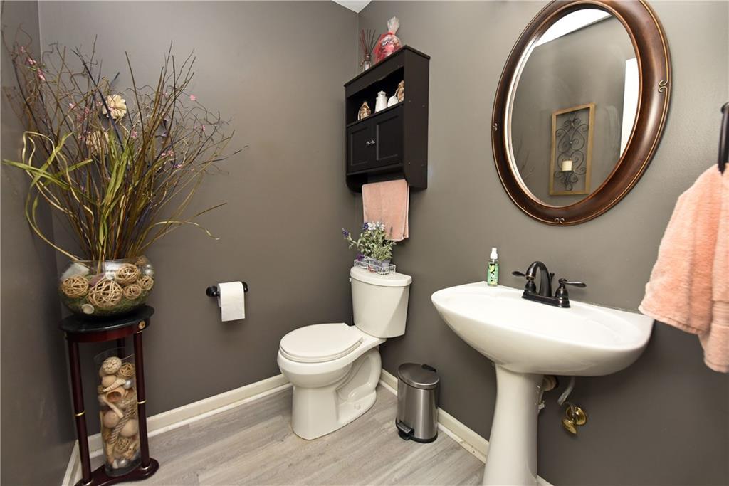107 East Clinton Drive Southwest Rome, GA 30165 - Photo 18 of 38 a bathroom with a sink toilet and a mirror