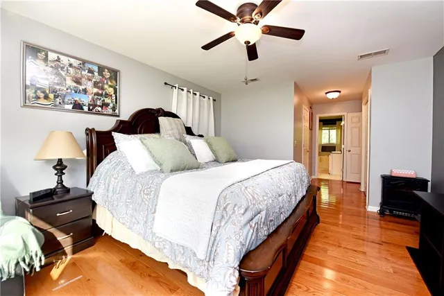 a bedroom with bed and window