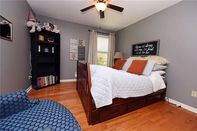 a bedroom with a bed and dresser