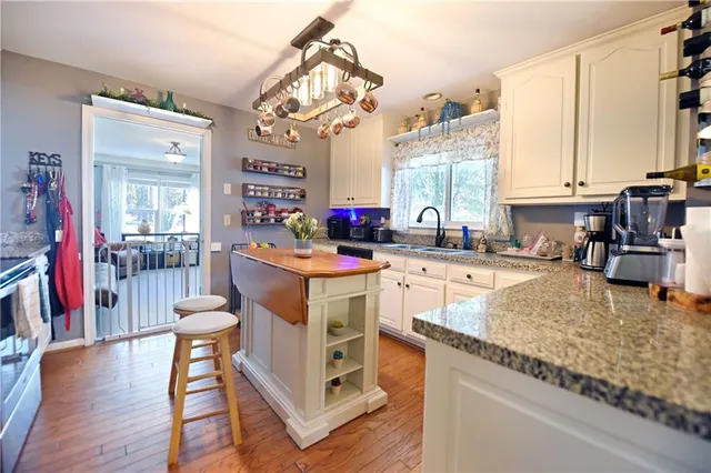 a kitchen with stove and cabinets