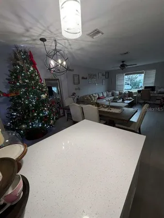 a kitchen with a refrigerator and a stove
