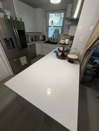a view of a dining room with furniture and window