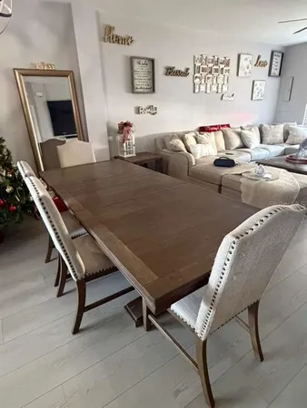 a living room with furniture and a lamp