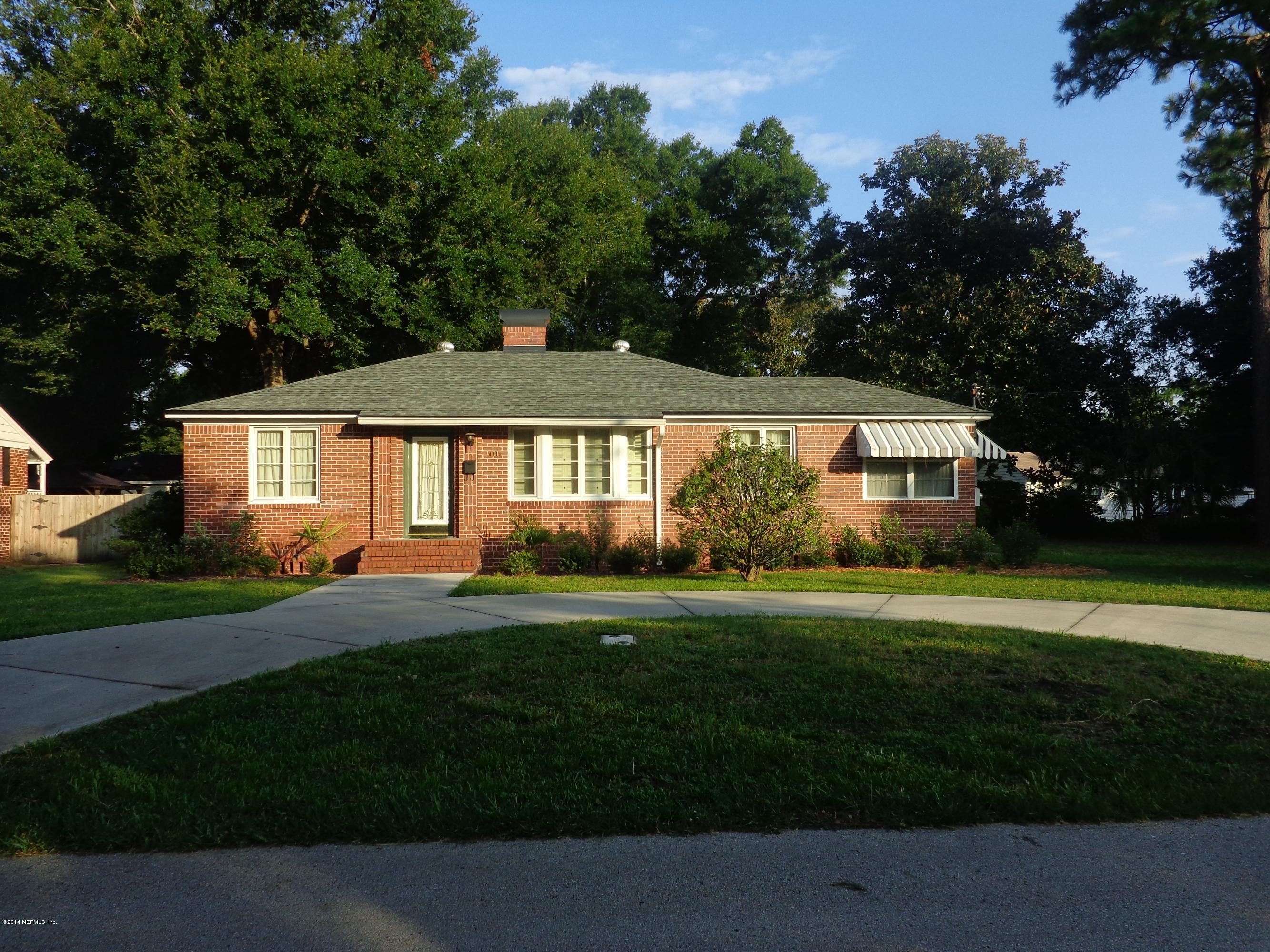 4114 London Road Jacksonville, FL 32207 - Photo 1 of 16 a front view of a house with a yard