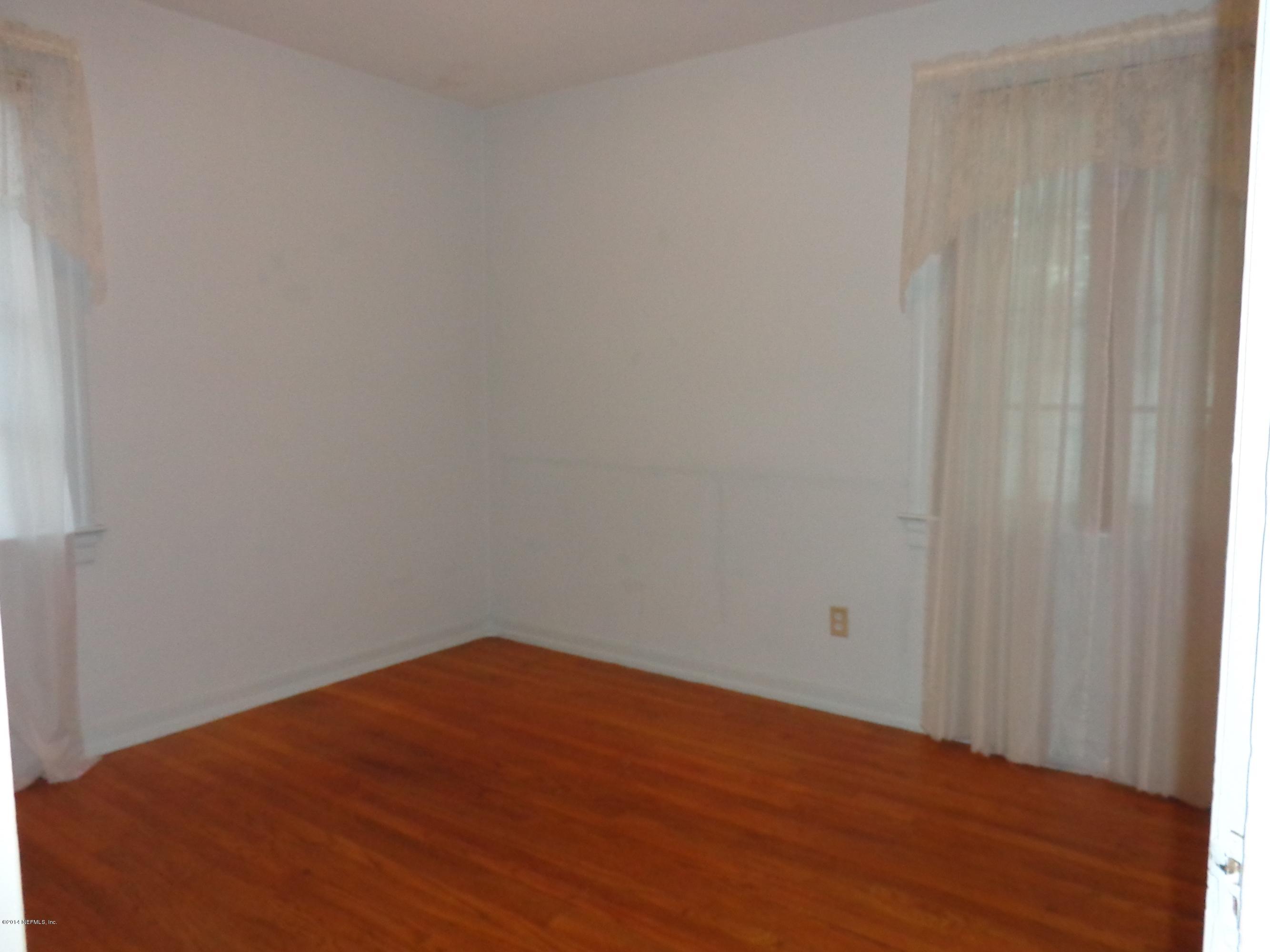 4114 London Road Jacksonville, FL 32207 - Photo 12 of 16 a view of empty room with wooden floor