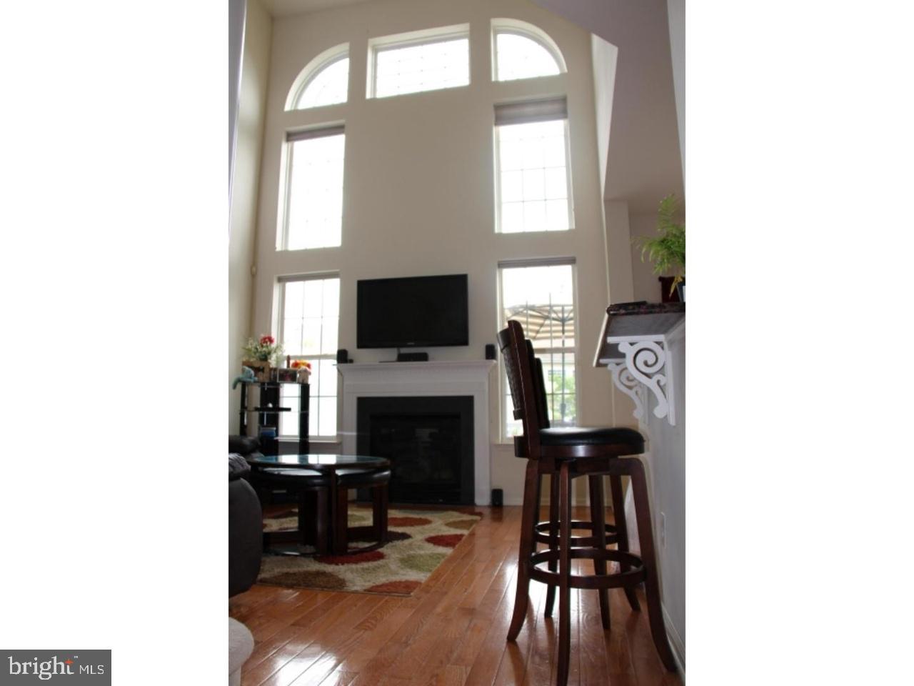 8 Stafford Drive Princeton Junction, NJ 08550 - Photo 4 of 7 a living room with furniture and a fireplace