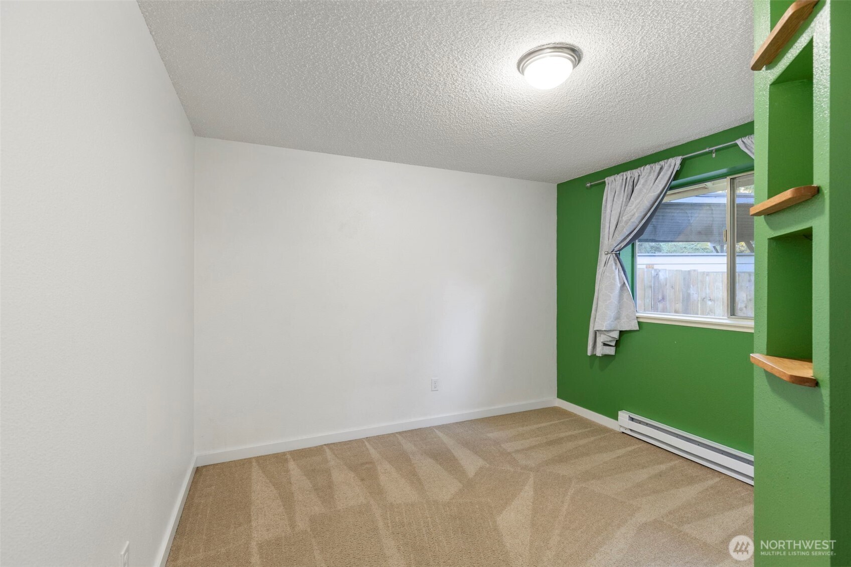 7606 Sandy Way Northeast Poulsbo, WA 98370 - Photo 11 of 20 a view of an empty room with a window