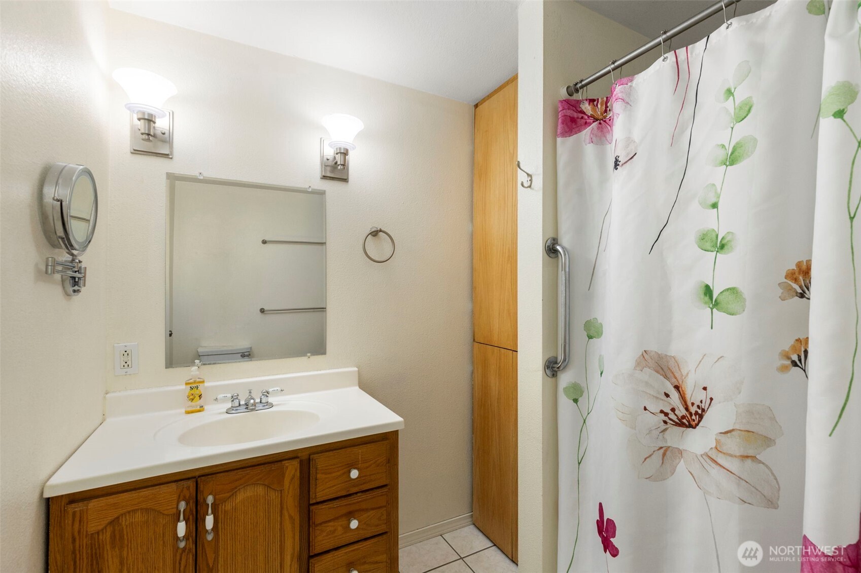 7606 Sandy Way Northeast Poulsbo, WA 98370 - Photo 9 of 20 a bathroom with a sink vanity mirror and shower