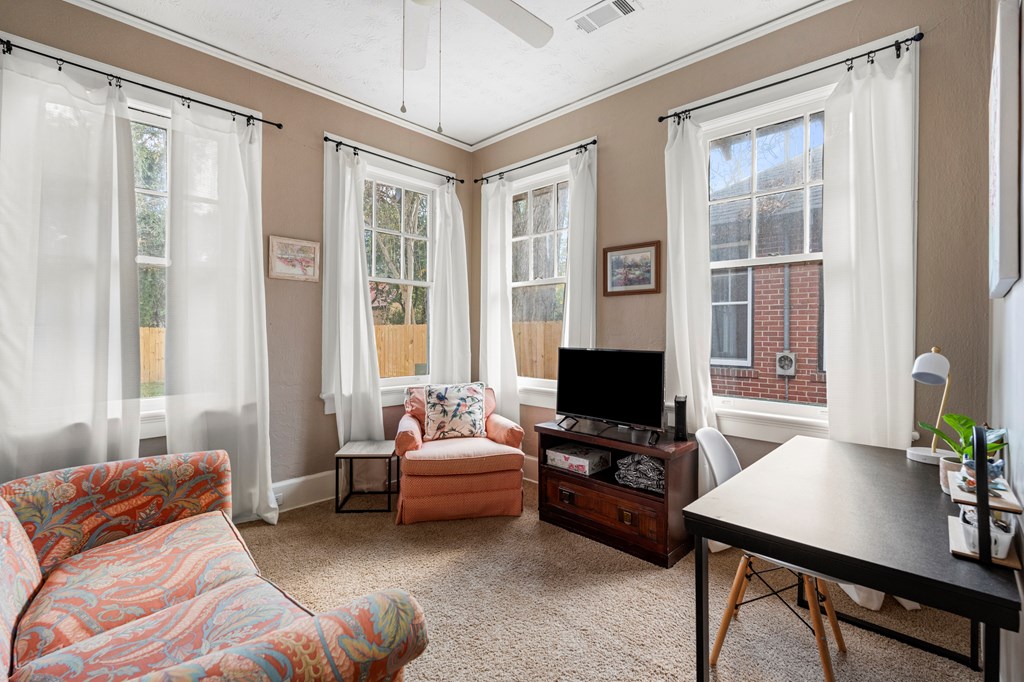 820 2nd Avenue Columbus, GA 31901 - Photo 14 of 28 a bedroom with a bed and a flat screen tv