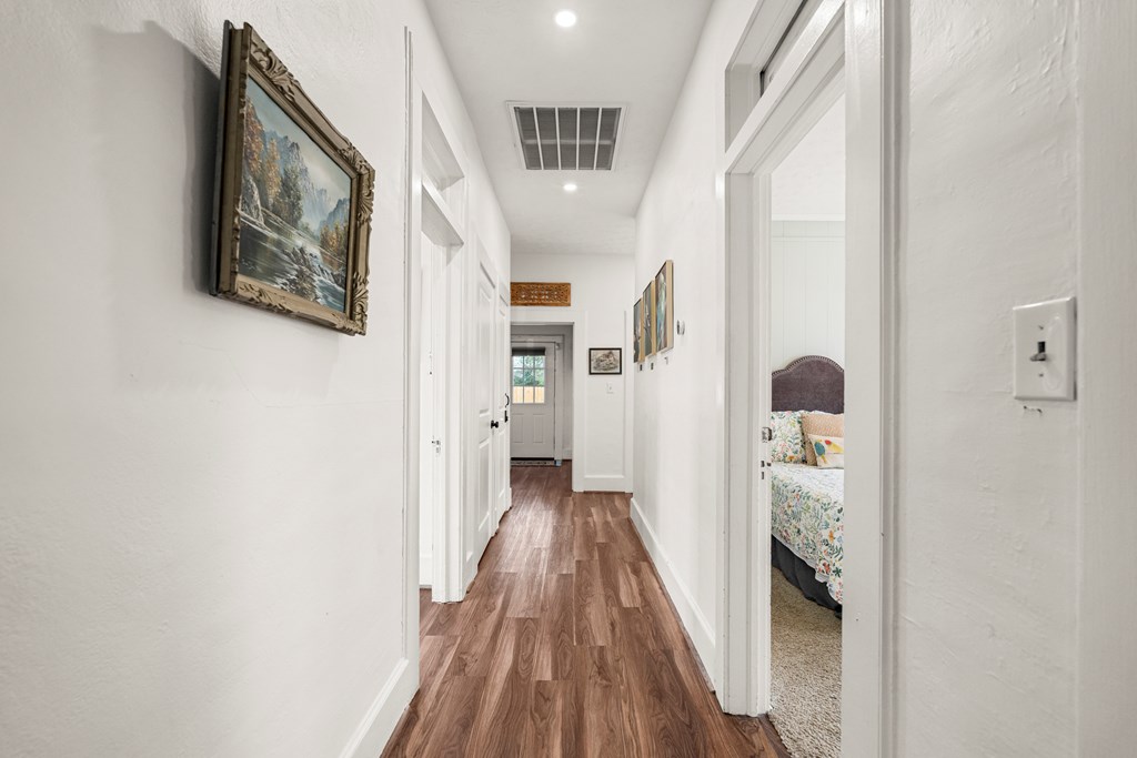 820 2nd Avenue Columbus, GA 31901 - Photo 15 of 28 a view of a hallway with wooden floor and staircase