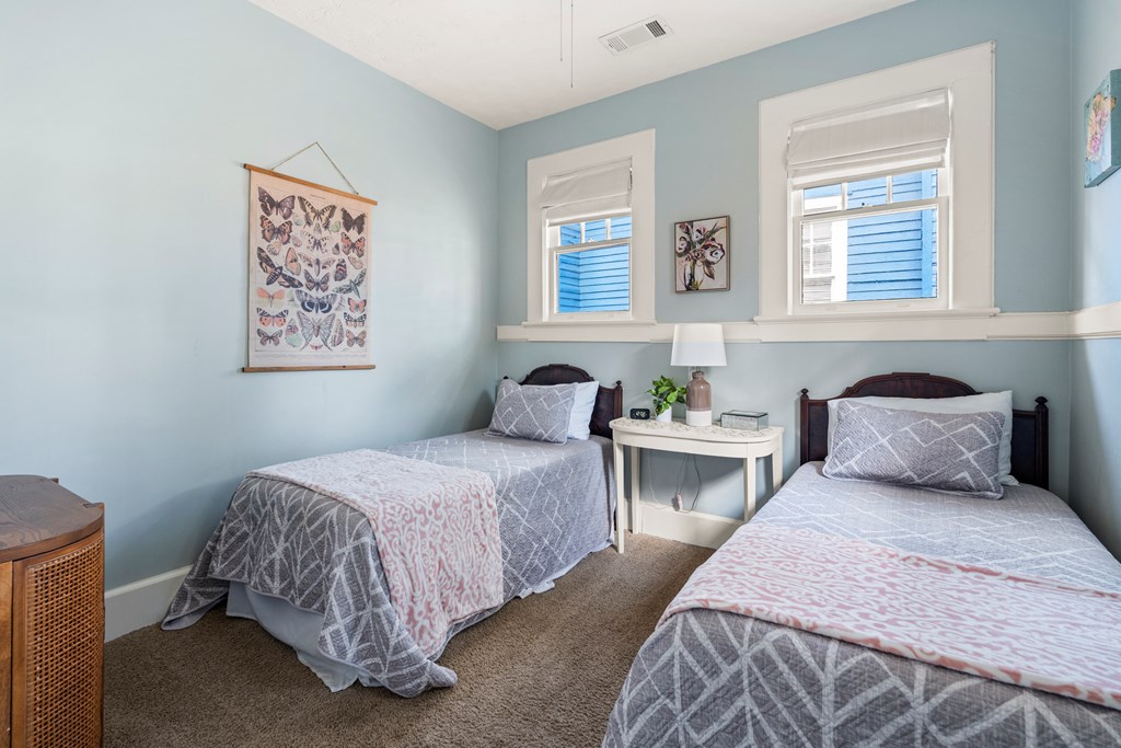 820 2nd Avenue Columbus, GA 31901 - Photo 16 of 28 a bedroom with two beds and a potted plant