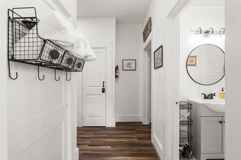820 2nd Avenue Columbus, GA 31901 - Photo 20 of 28 a view of a hallway with wooden floor and staircase