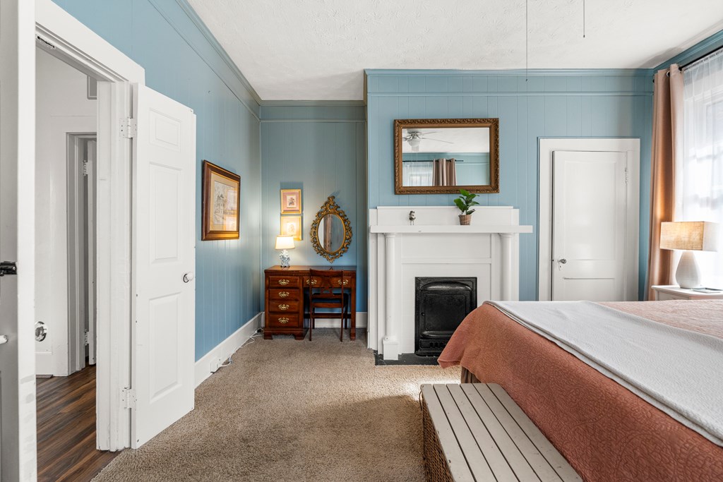 820 2nd Avenue Columbus, GA 31901 - Photo 22 of 28 a bedroom with a bed and a fireplace