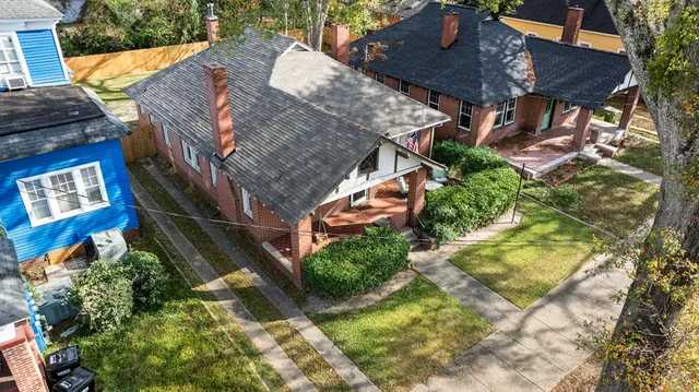 a aerial view of a house with a yard