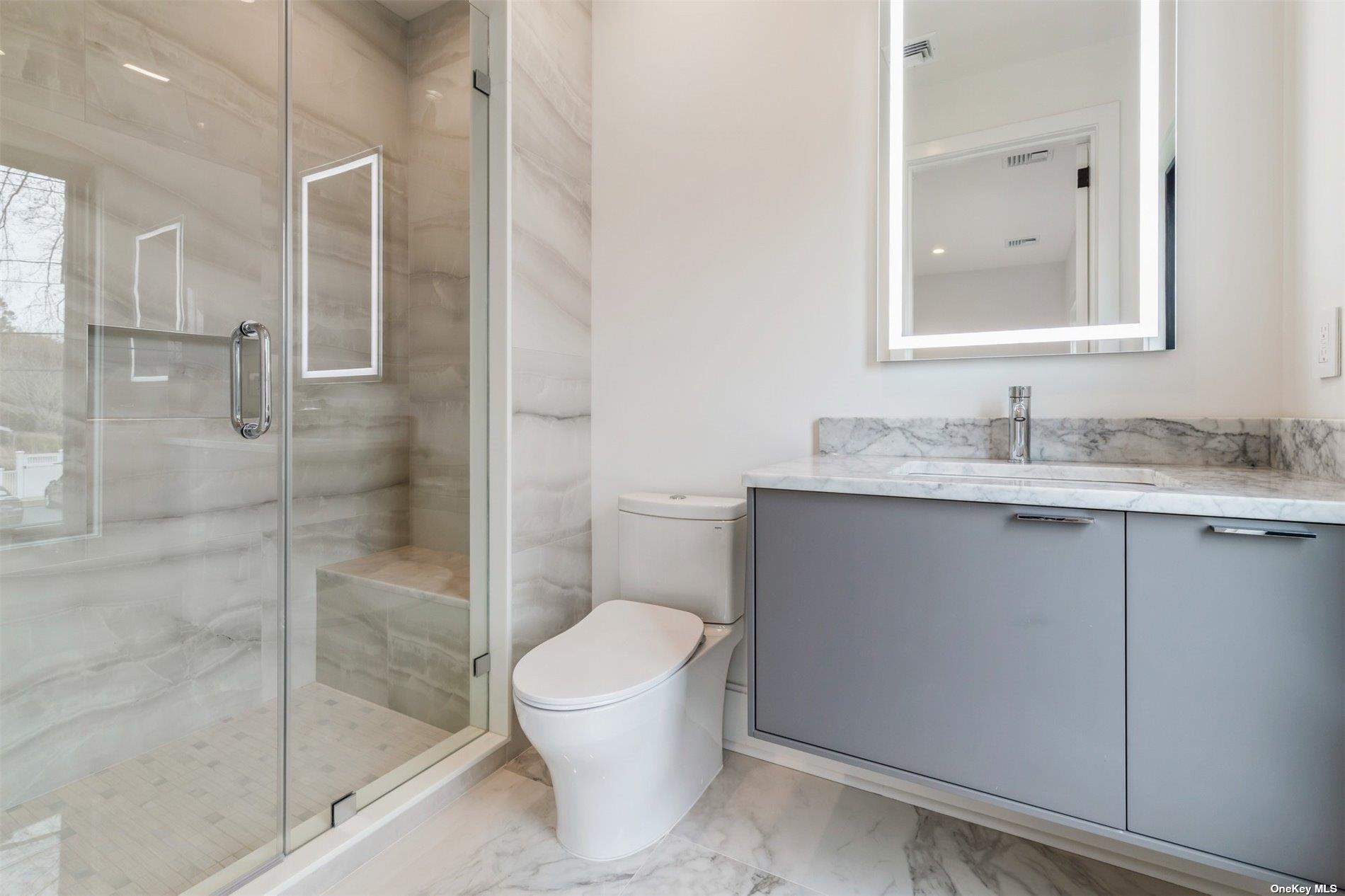 38 Sherrill Road East Hampton, NY 11937 - Photo 12 of 21 a bathroom with a granite countertop sink toilet and shower