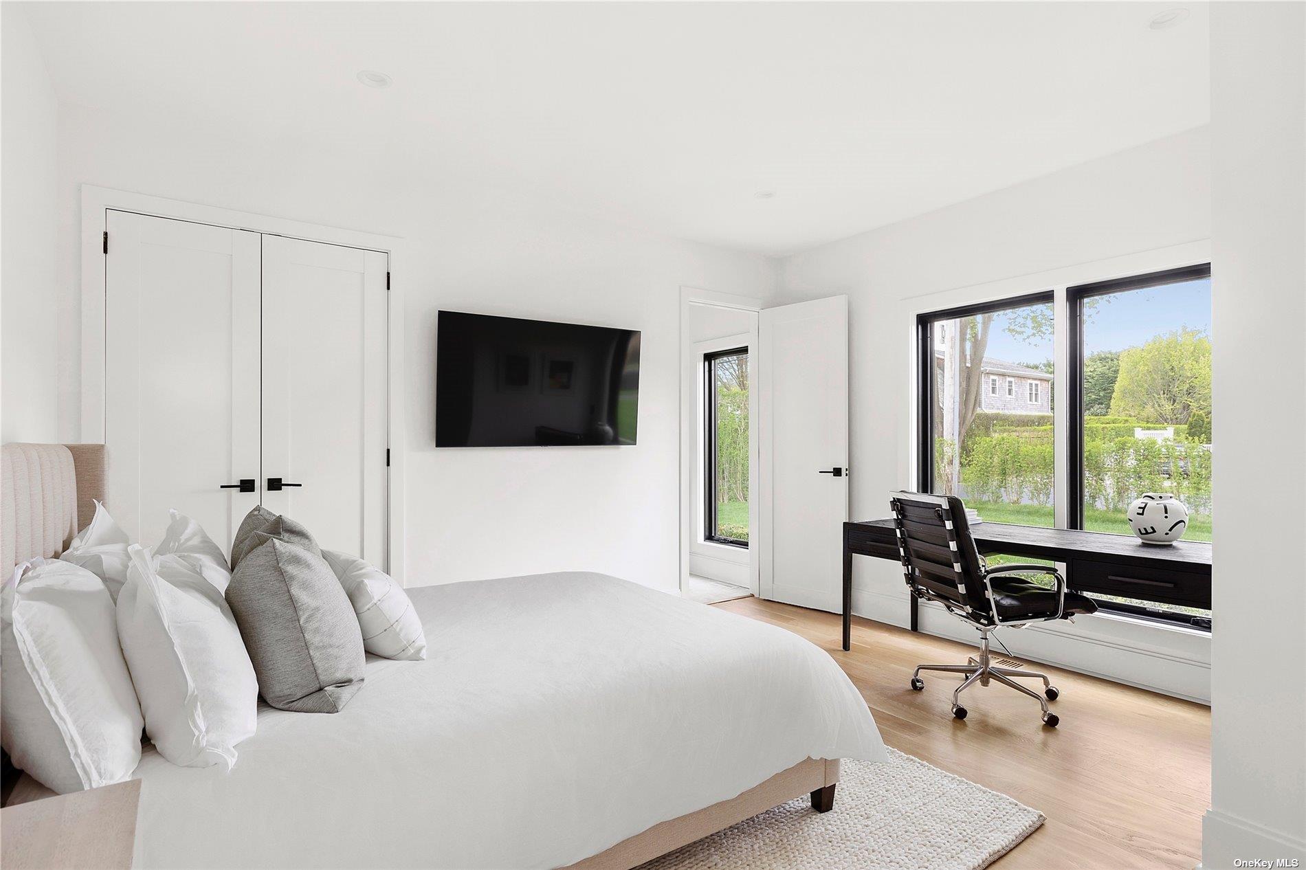 38 Sherrill Road East Hampton, NY 11937 - Photo 13 of 21 a bedroom with a bed and a flat tv screen