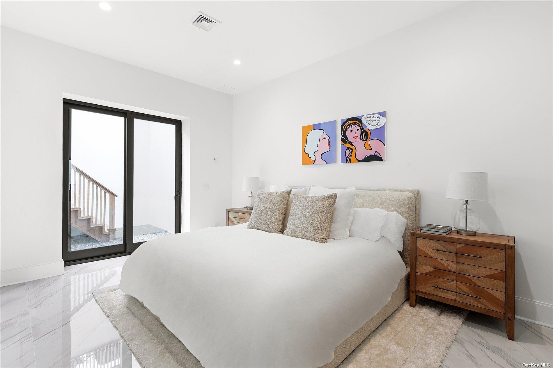 38 Sherrill Road East Hampton, NY 11937 - Photo 16 of 21 a bedroom with a bed and a window