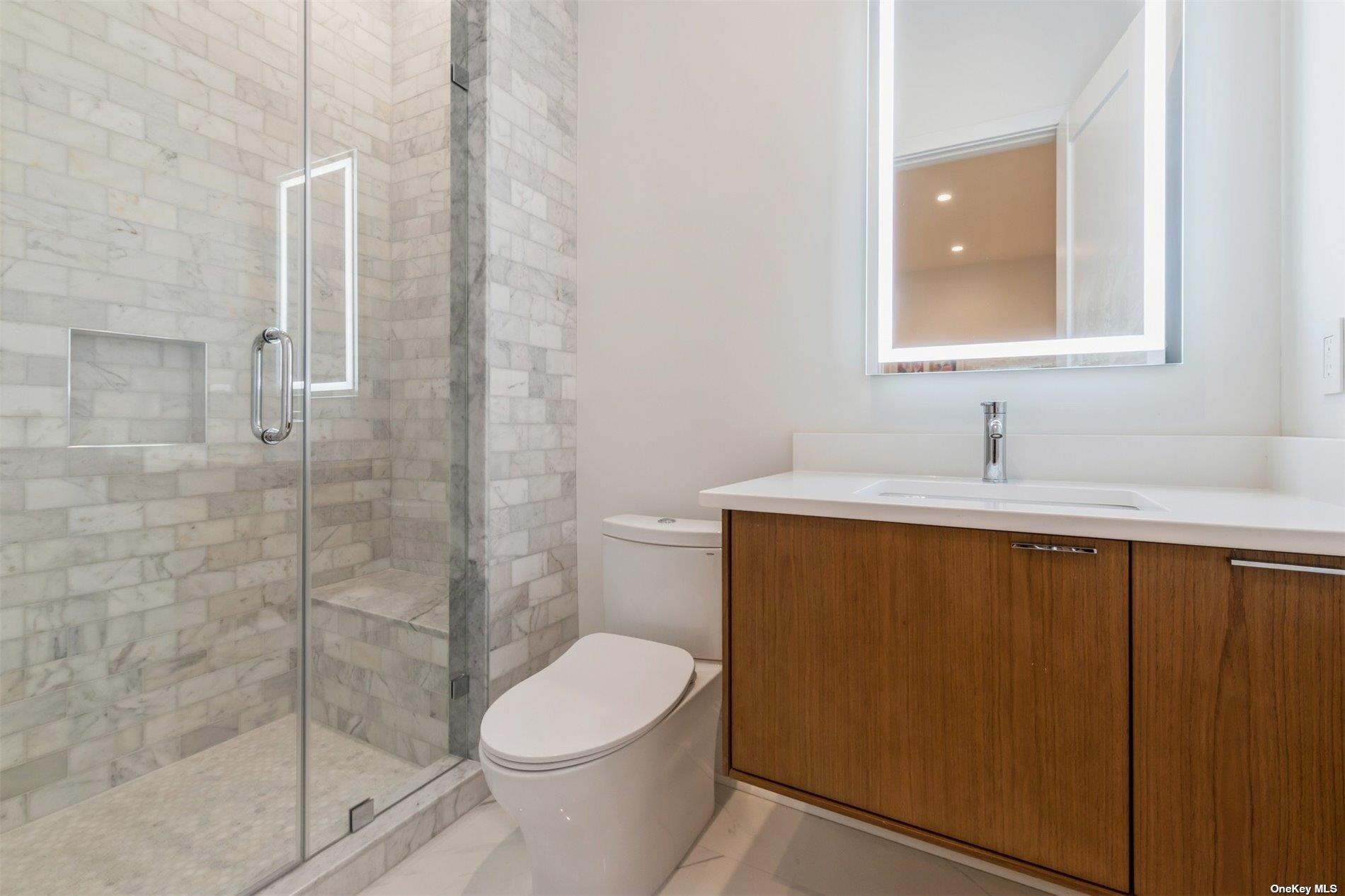38 Sherrill Road East Hampton, NY 11937 - Photo 17 of 21 a bathroom with a sink a toilet and shower