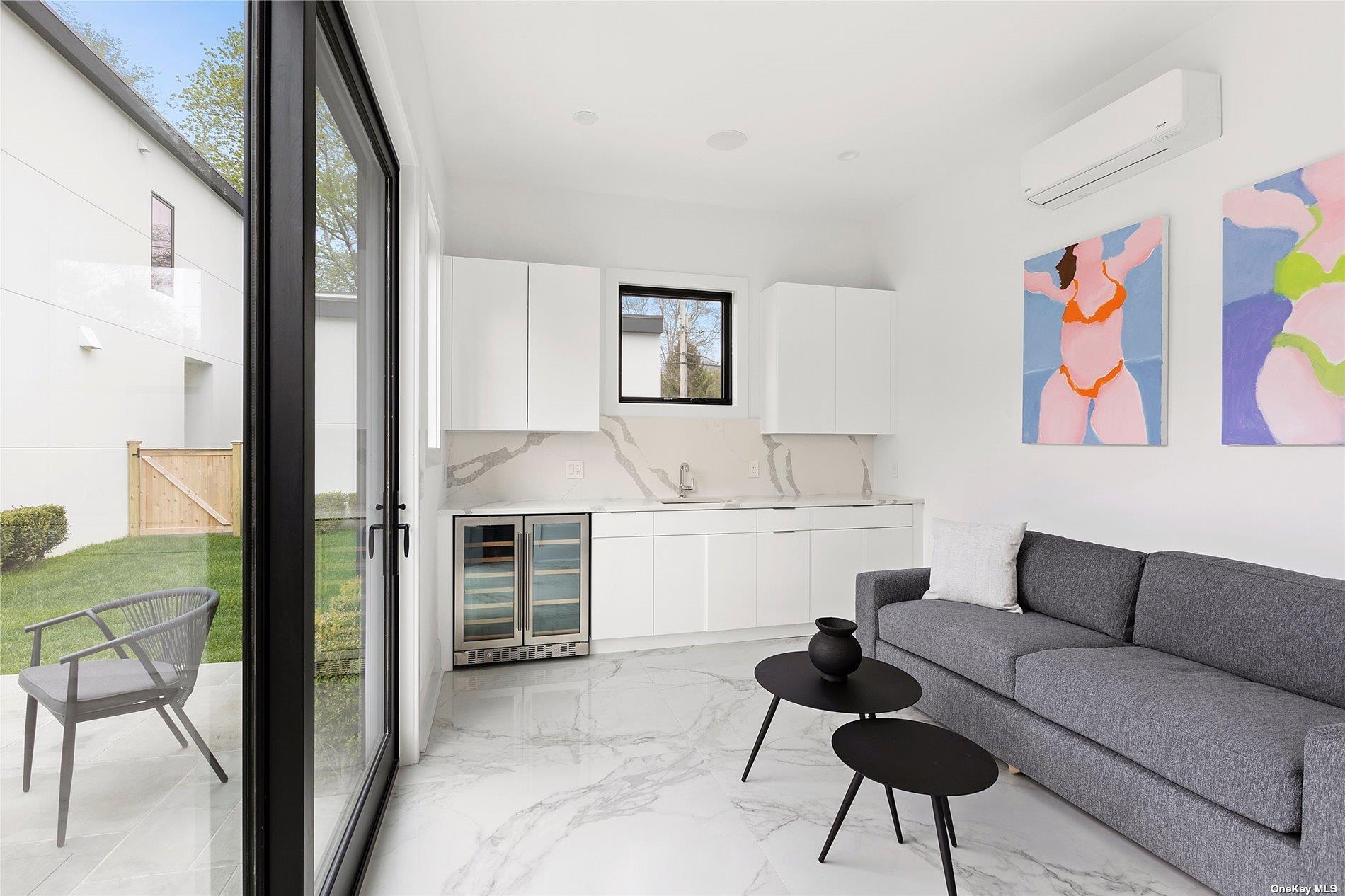 38 Sherrill Road East Hampton, NY 11937 - Photo 20 of 21 a living room with furniture and a kitchen view