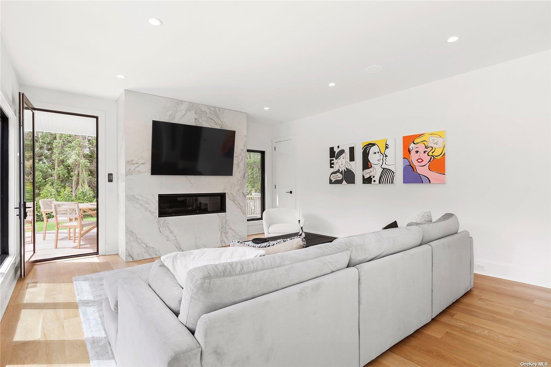 38 Sherrill Road East Hampton, NY 11937 - Photo 3 of 21 a living room with furniture and a flat screen tv