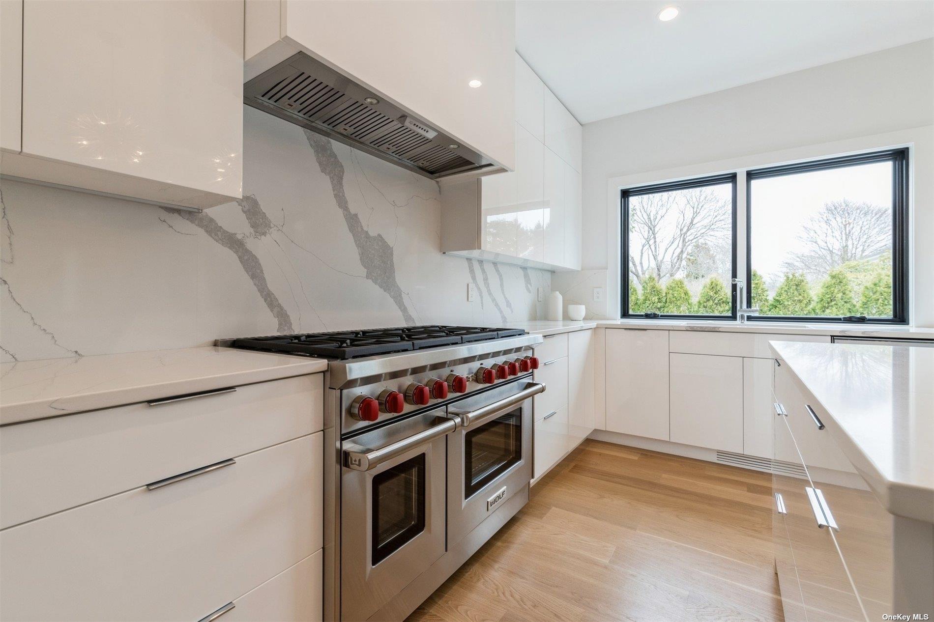 38 Sherrill Road East Hampton, NY 11937 - Photo 6 of 21 a kitchen with a stove and a microwave