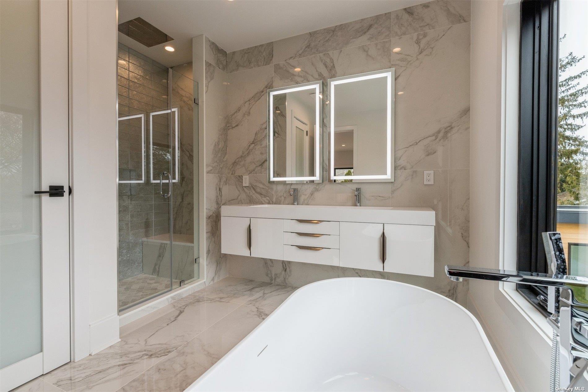 38 Sherrill Road East Hampton, NY 11937 - Photo 10 of 21 a bathroom with a tub sink and mirror