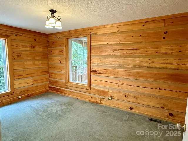 a view of empty room with windows