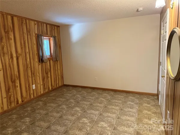 a view of a hallway with wooden shelves