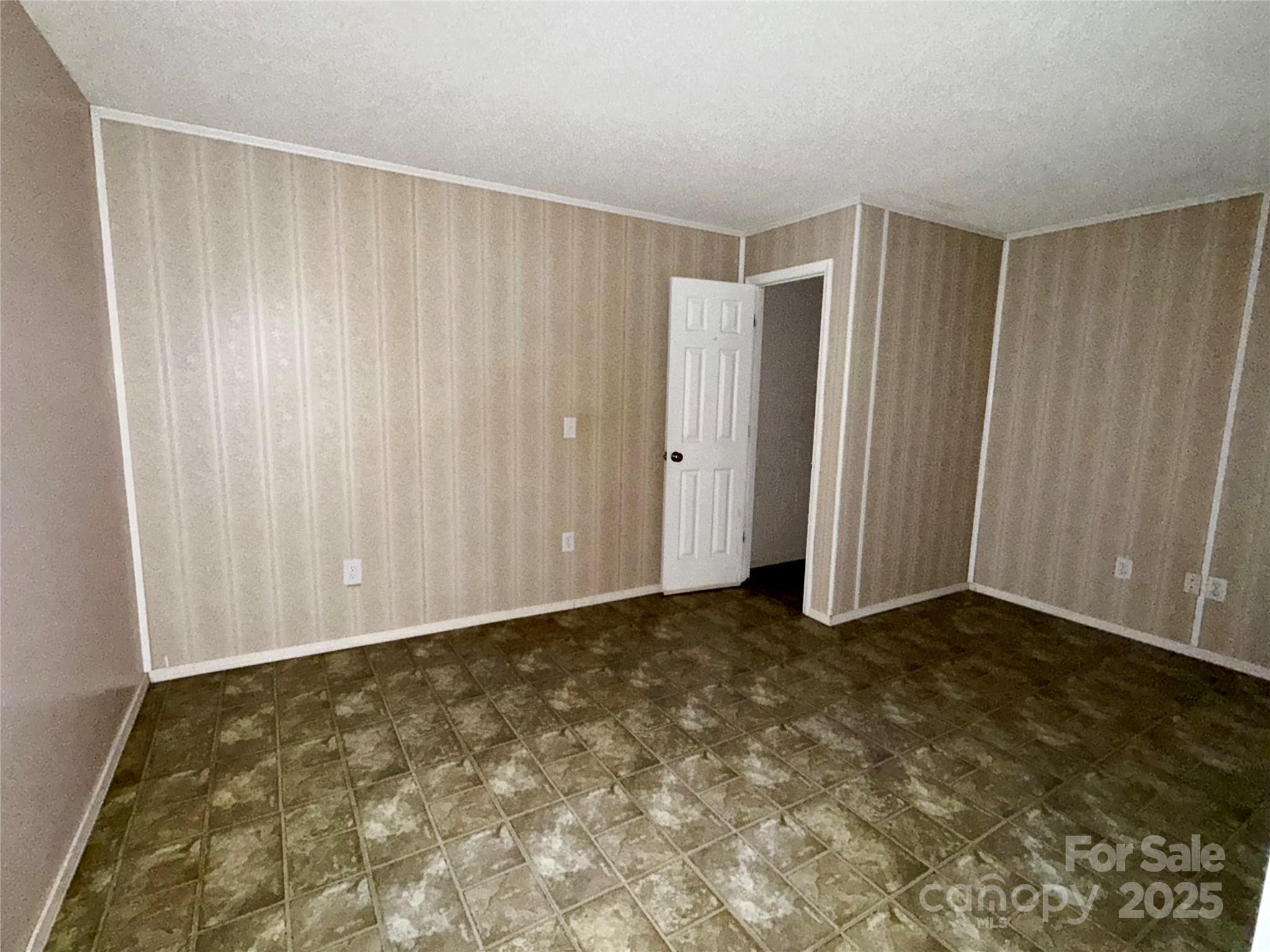 66 Ashlyn Lane Tryon, NC 28782 - Photo 37 of 40 a view of an empty room with wooden floor