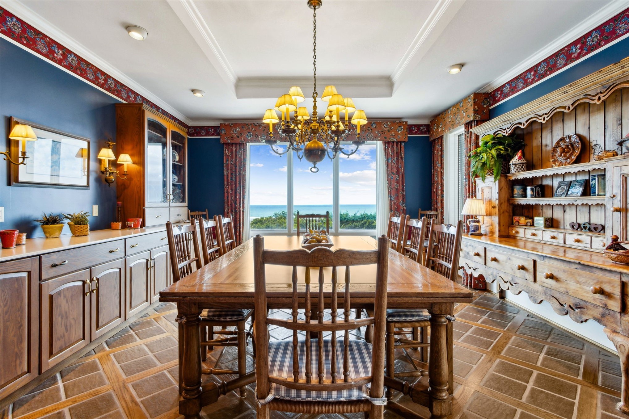 28 Dunes Row Fernandina Beach, FL 32034 - Photo 11 of 96 a view of a dining room with furniture a chandelier and large windows