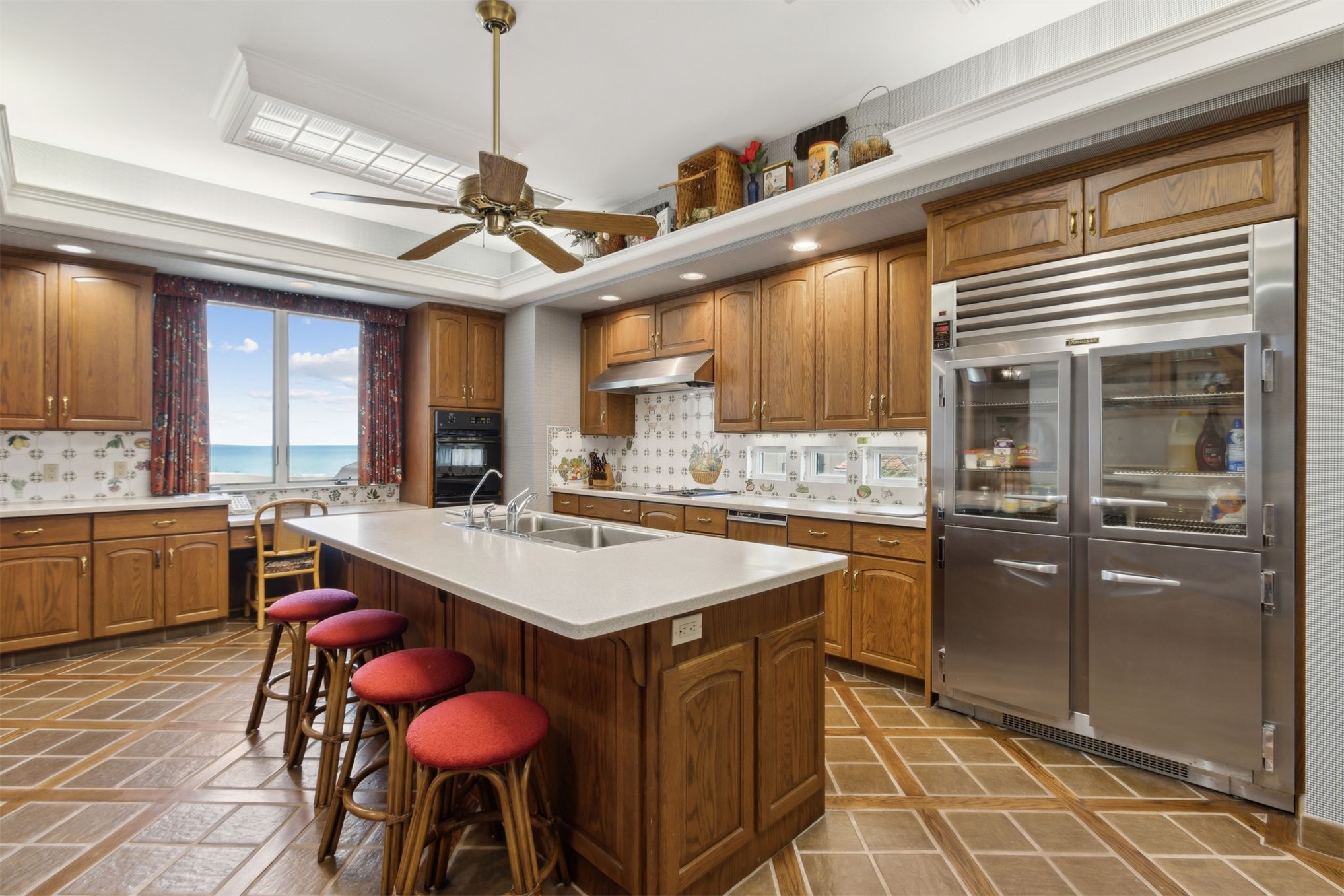 28 Dunes Row Fernandina Beach, FL 32034 - Photo 14 of 99 a kitchen with stainless steel appliances granite countertop a sink a stove a refrigerator and island